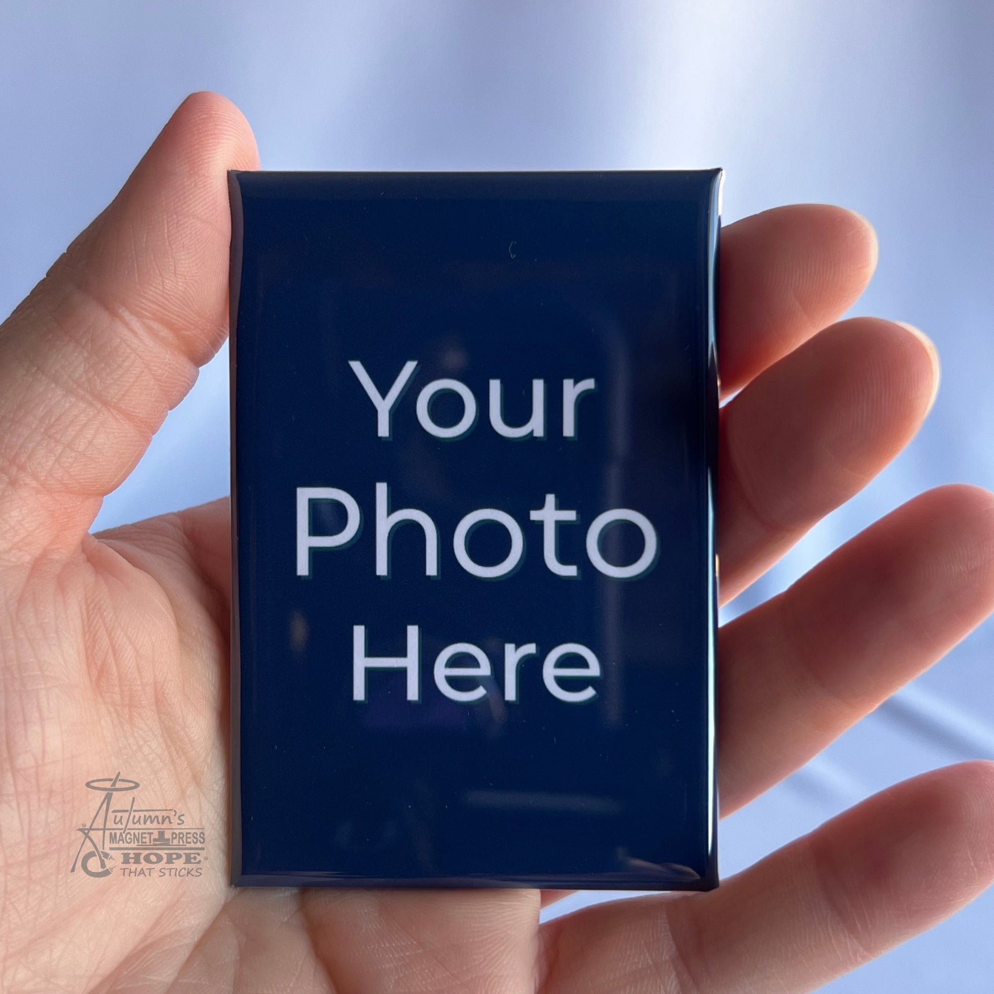 2x3 vertical custom photo magnet held in hand