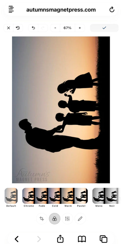 A digital preview of a photo print or magnet design showing a silhouette of a family standing on a grassy field against a warm sunset gradient. The image is presented inside a mobile browser or app interface with the URL autumnsmagnetpress.