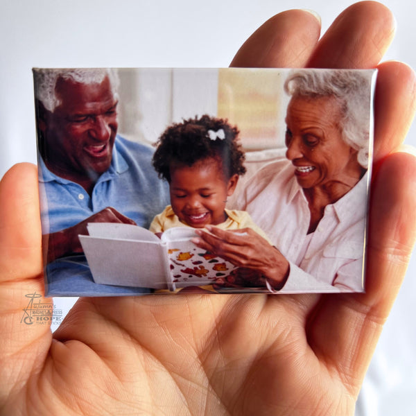 Custom family photo magnet showing grandparents reading with their granddaughter during a special everyday moment together.