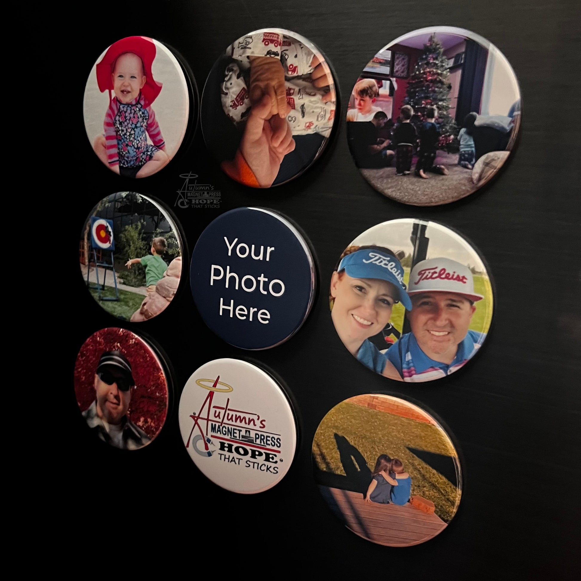 Set of 9 round custom photo magnets showing family memories arranged on a dark metal surface